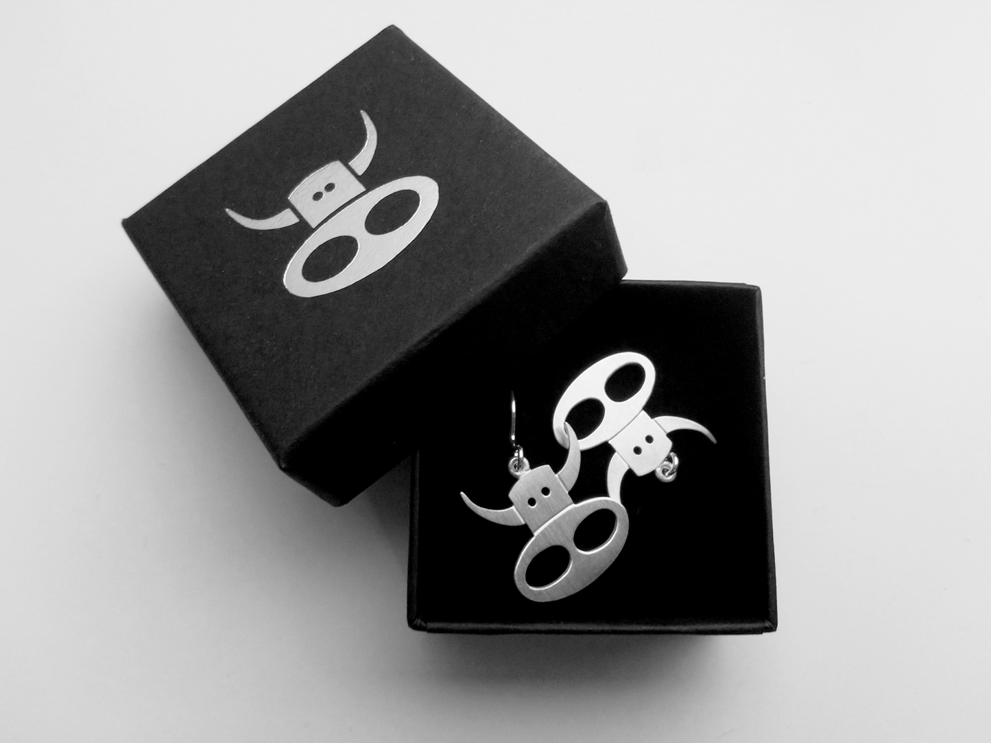 Silver cow earrings
