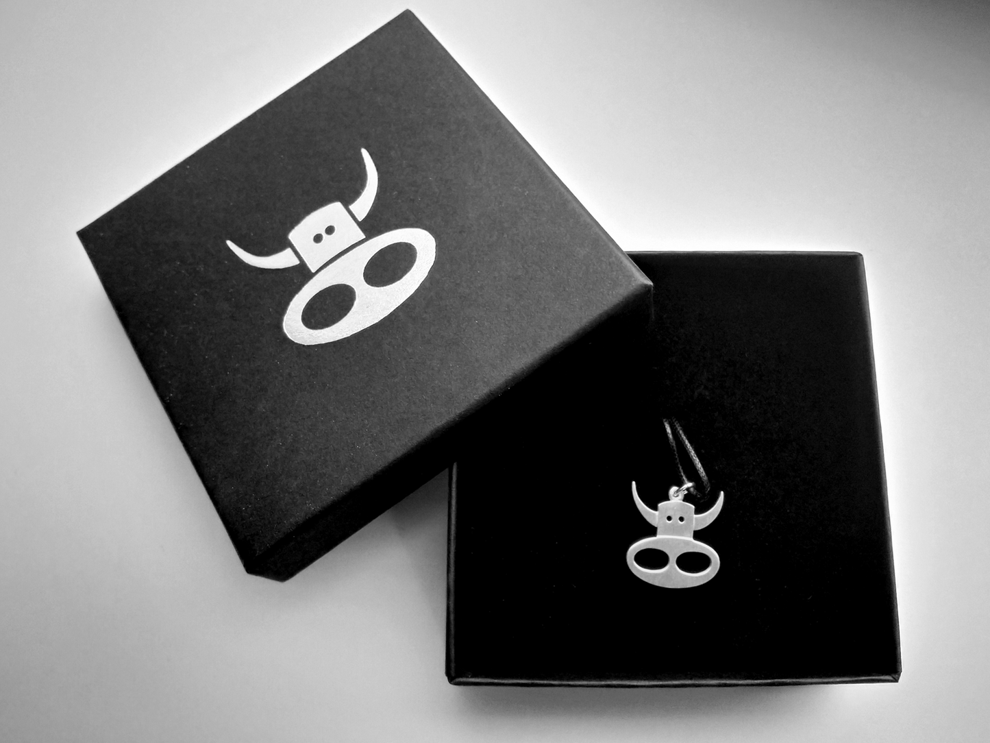 Silver cow necklace